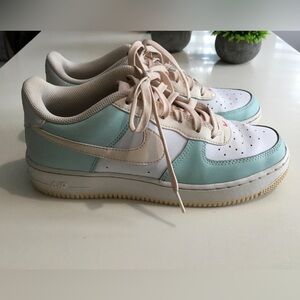 Nike Air Force 1 White and Mint Sneakers with Pink Accents.